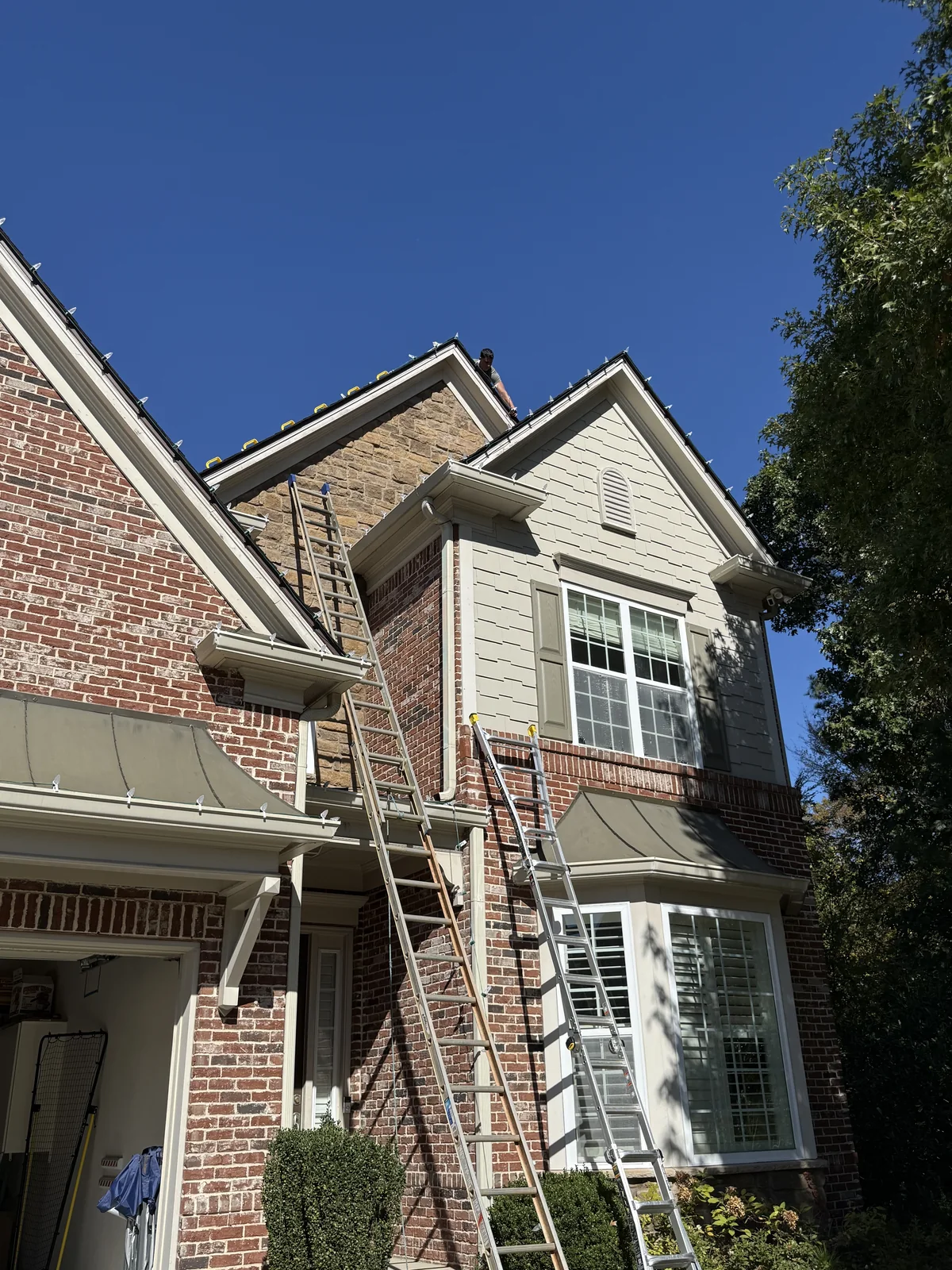 Bright Lights GA crew installing Christmas lights on a Metro Atlanta home